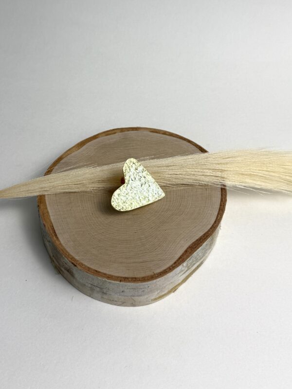 Golden-Love-ring-heart-shaped-crafted-in-18k-gold-plated-bronze-with-a-delicate-hammered-finish-that-highlights-its-unique-shine-and-texture