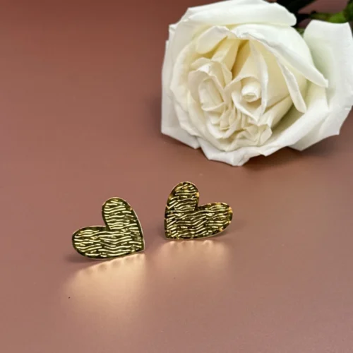 Golden-Passion-earrings-crafted-in-18k-gold-plated-bronze-with-a-wavy-pattern-that-evokes-movement-and-depth