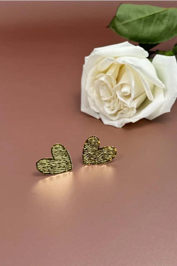 Golden-Passion-earrings-crafted-in-18k-gold-plated-bronze-with-a-wavy-pattern-that-evokes-movement-and-depth