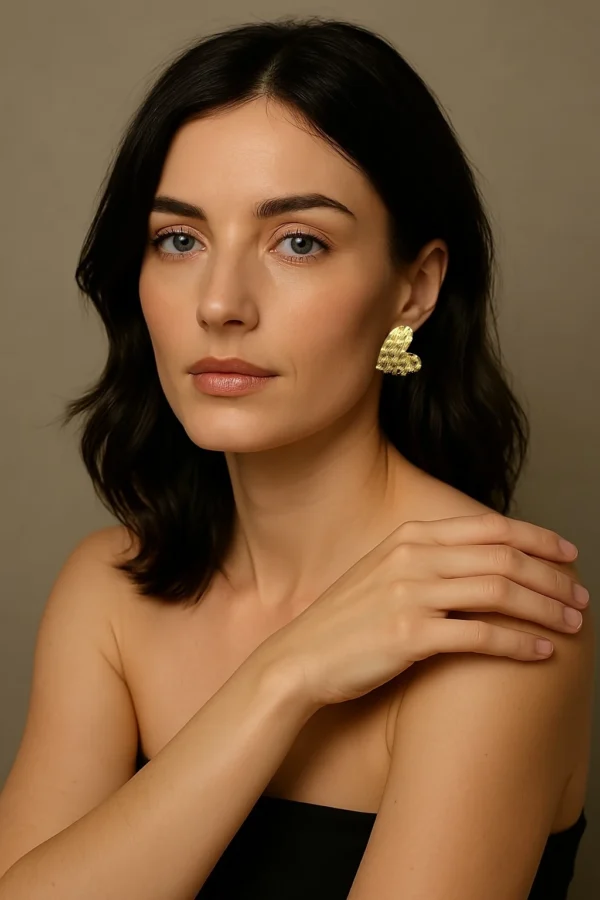 Golden-Passion-earrings-crafted-in-18k-gold-plated-bronze-with-a-wavy-pattern-that-evokes-movement-and-depth