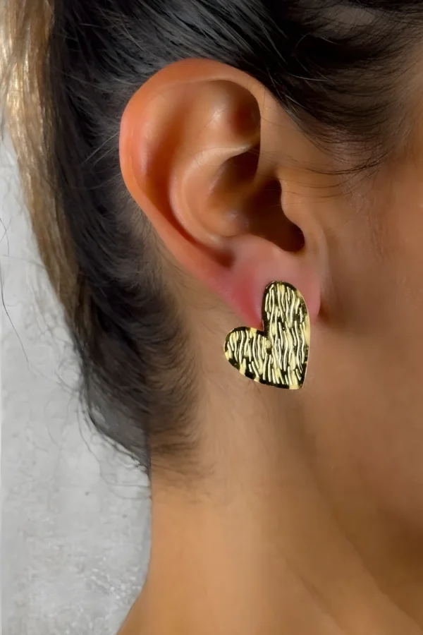 Golden-Passion-earrings-crafted-in-18k-gold-plated-bronze-with-a-wavy-pattern-that-evokes-movement-and-depth