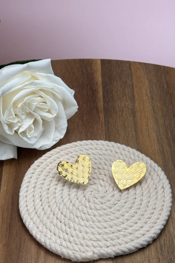 Golden-Passion-earrings-crafted-in-18k-gold-plated-bronze-with-a-wavy-pattern-that-evokes-movement-and-depth