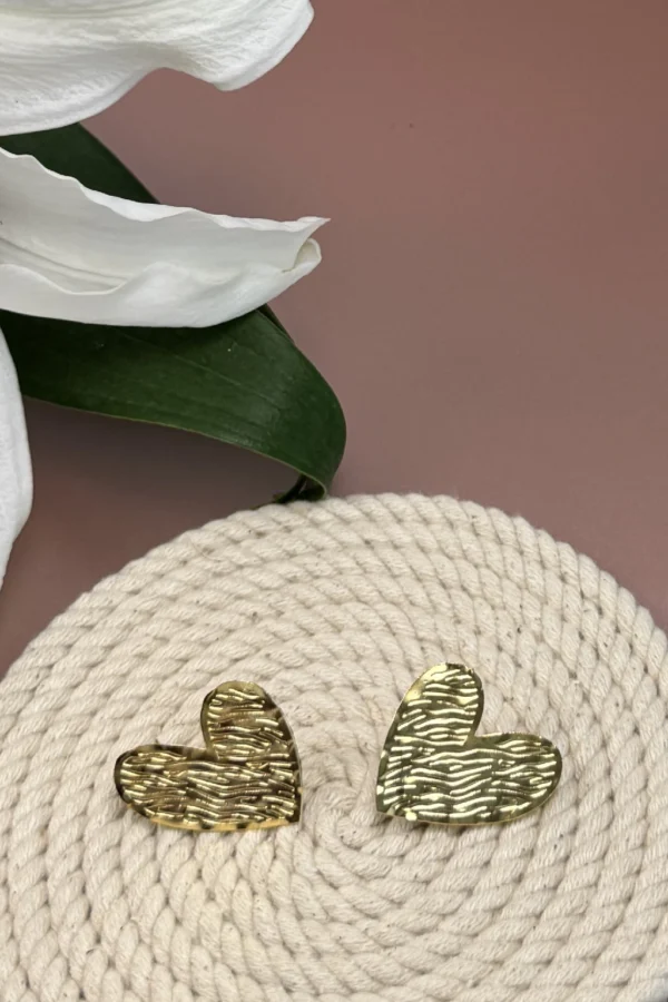 Golden-Passion-earrings-crafted-in-18k-gold-plated-bronze-with-a-wavy-pattern-that-evokes-movement-and-depth