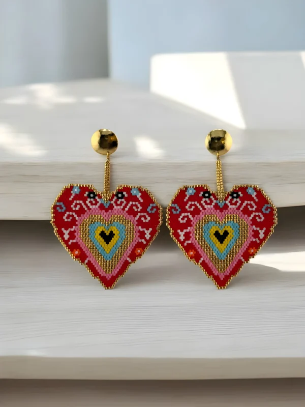 Sacred-Heart-earrings-handcrafted-with-Miyuki-beads-woven-piece-by-piece-in-a-design-inspired-by-ex-voto-hearts
