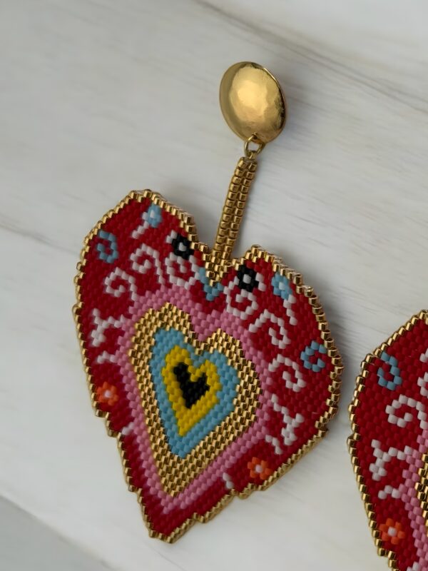 Sacred-Heart-earrings-handcrafted-with-Miyuki-beads-woven-piece-by-piece-in-a-design-inspired-by-ex-voto-hearts