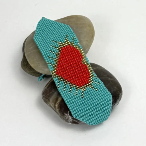 Heartbeat-of-the-Soul-bracelet-handwoven-in-Czech-beads-with-a-red-heart-design-on-a-vibrant-blue-background