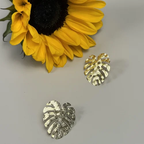 Jungle-earrings-in-monstera-leaf-shape-crafted-in-18k-gold-plated-bronze-with-a-textured-finish-that-enhances-their-organic-design
