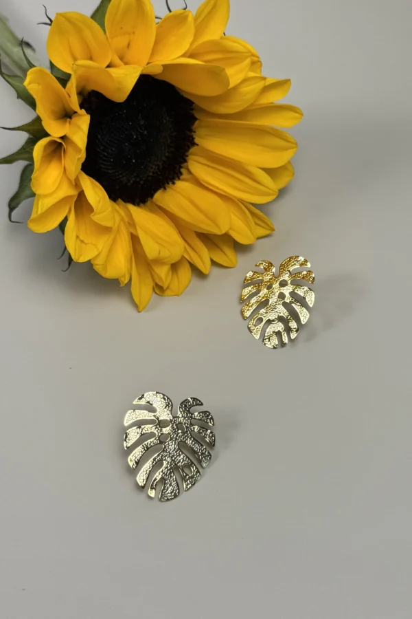 Jungle-earrings-in-monstera-leaf-shape-crafted-in-18k-gold-plated-bronze-with-a-textured-finish-that-enhances-their-organic-design