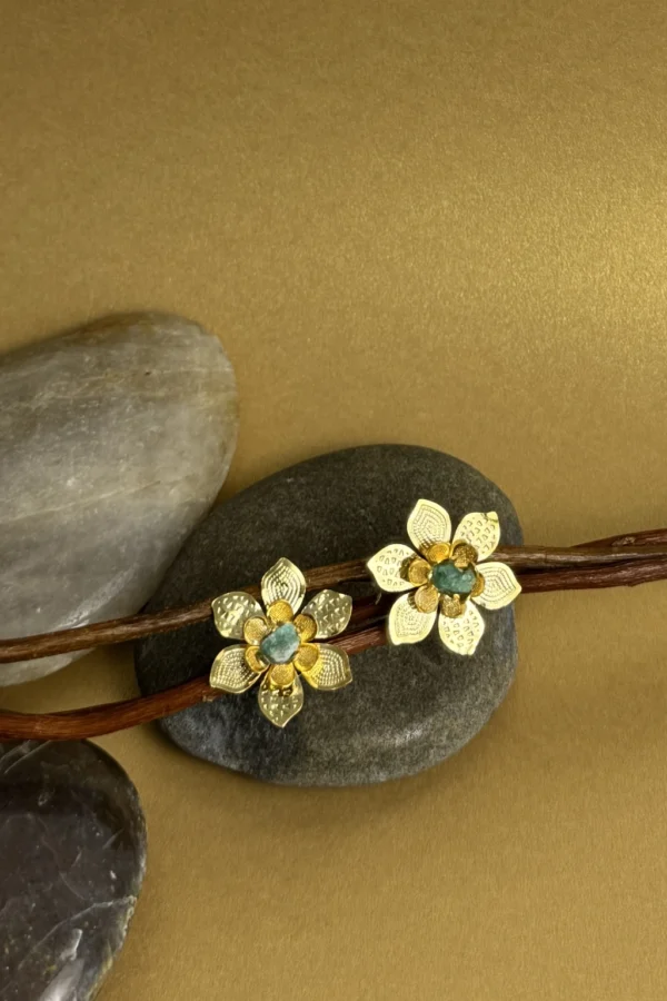 Natural-Essence-earrings-crafted-in-18k-gold-plated-bronze-with-a-young-emerald-at-the-center