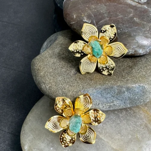 Natural-Essence-earrings-crafted-in-18k-gold-plated-bronze-with-a-young-emerald-at-the-center