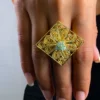 Royal-Essence-ring-crafted-in-18k-gold-plated-bronze-with-a-detailed-geometric-design