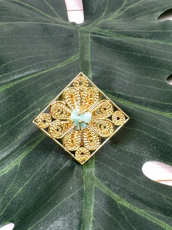 Royal-Essence-ring-crafted-in-18k-gold-plated-bronze-with-a-detailed-geometric-design