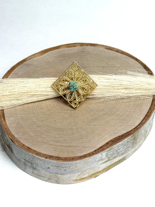 Royal-Essence-ring-crafted-in-18k-gold-plated-bronze-with-a-detailed-geometric-design
