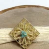 Royal-Essence-ring-crafted-in-18k-gold-plated-bronze-with-a-detailed-geometric-design