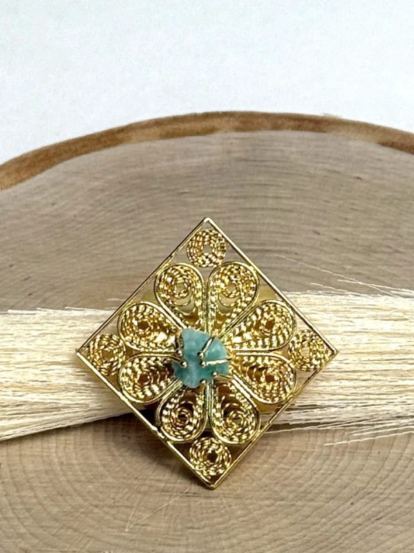 Royal-Essence-ring-crafted-in-18k-gold-plated-bronze-with-a-detailed-geometric-design