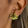 Sacred-Lotus-earrings-crafted-in-18k-gold-plated-bronze-with-a-young-emerald-in-the-center