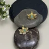 Sacred-Lotus-earrings-crafted-in-18k-gold-plated-bronze-with-a-young-emerald-in-the-center